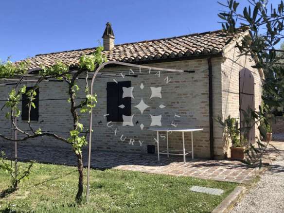 A Restored Boutique Hotel with Pool in the Hills of Le Marche